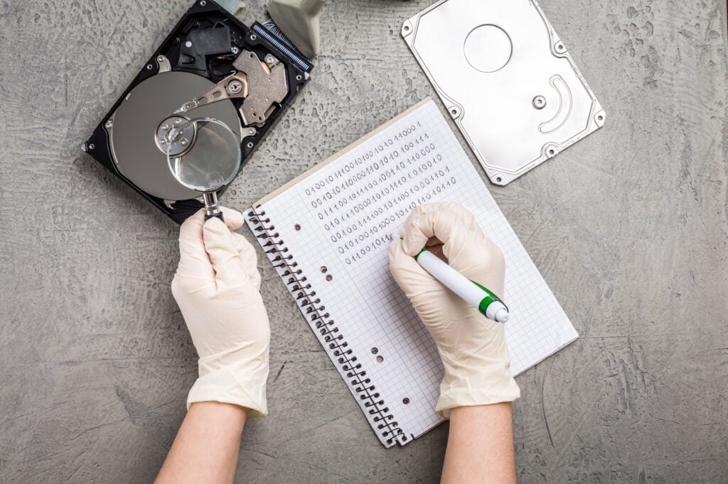 Concept of data recovery, engineer is recovering data from failed hard disk driver